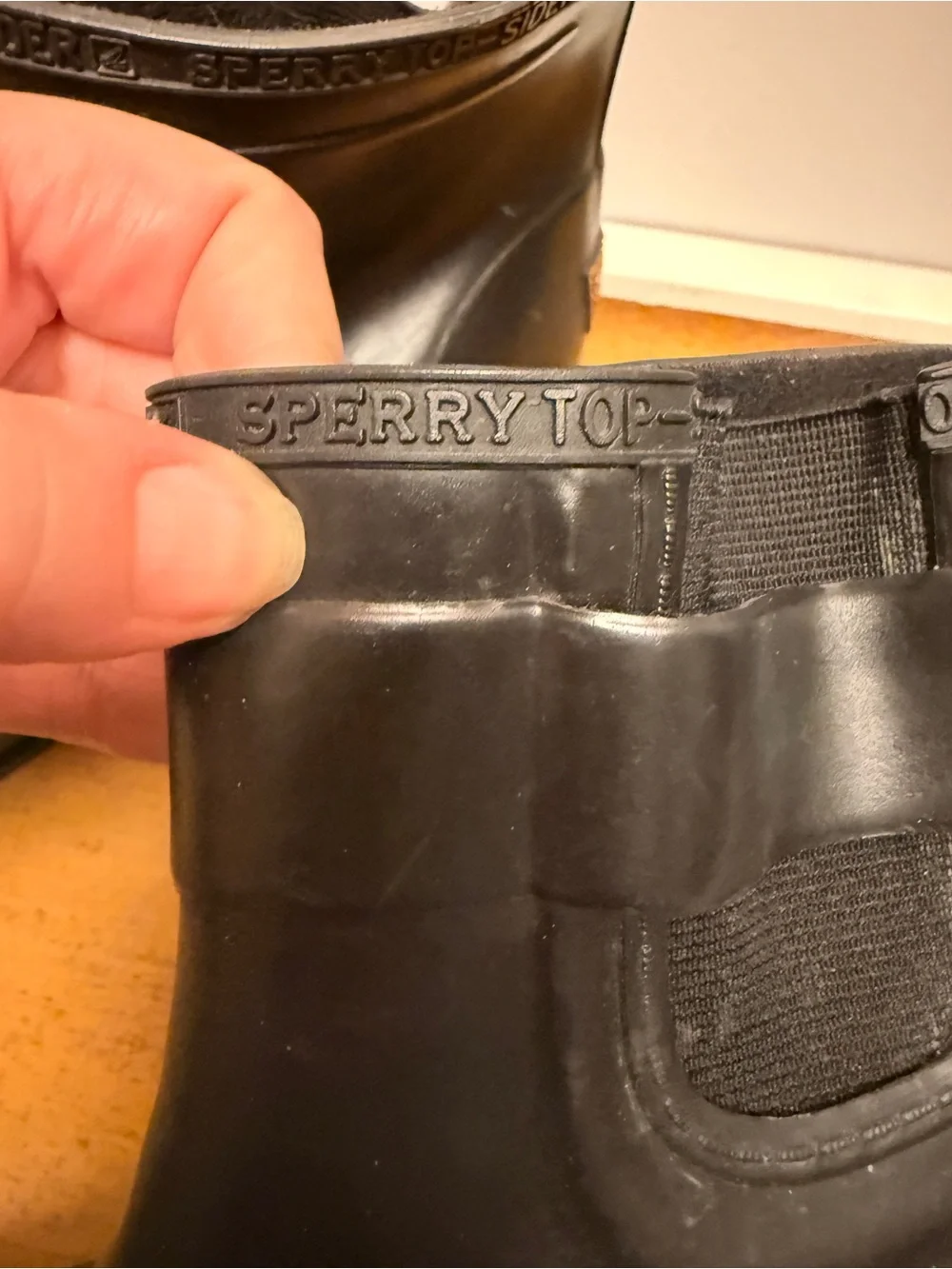 Sperry Black Ankle Rain Boots with Orange Logo Accent